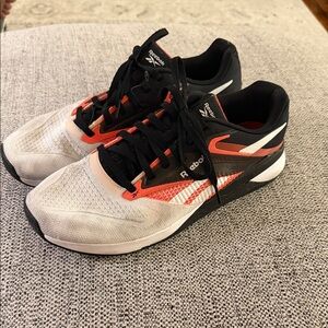 Reebok NANO X4 men’s White and Black Sneakers with Orange Highlights